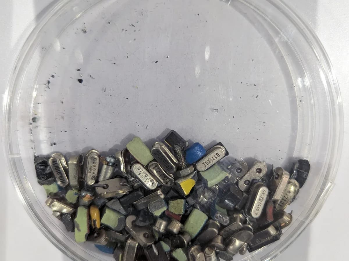 Small metal and electronic components separated in a clear sorting dish